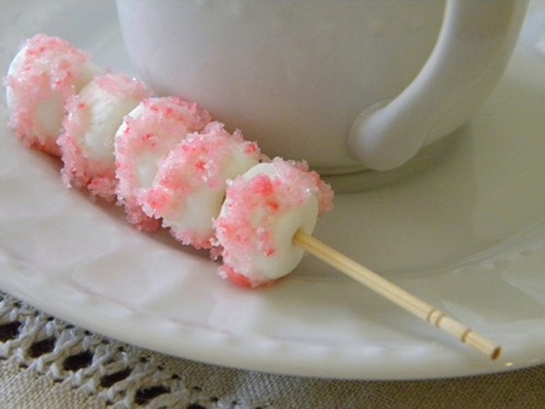 http://ediblecrafts.craftgossip.com/files/2012/01/candycane.marshmallows.jpg