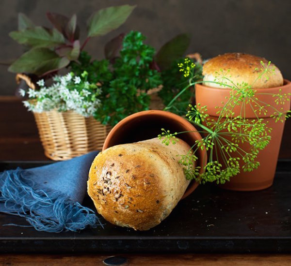 garlic bread with fresh herb in flower pots