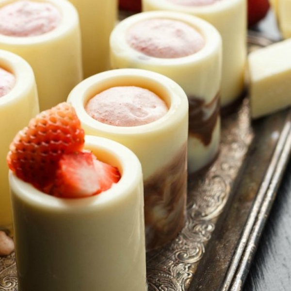 white chocolate shot glasses with strawberry mousse